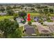 Aerial view of the property showing the house, roof, and surrounding community with a golf course at 3370 Highland Fairways Blvd, Lakeland, FL 33810