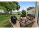 Backyard brick patio with comfortable seating and a lush, grassy area at 3370 Highland Fairways Blvd, Lakeland, FL 33810