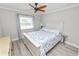 Bright bedroom with wood-look floors and plenty of natural light at 3370 Highland Fairways Blvd, Lakeland, FL 33810