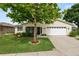 Well-maintained one-story home with landscaped front yard, inviting entrance, and attached two-car garage at 3370 Highland Fairways Blvd, Lakeland, FL 33810