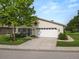 Inviting home featuring a well-maintained lawn, screened in porch and a two-car garage at 3370 Highland Fairways Blvd, Lakeland, FL 33810