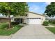 Inviting single-Gathering home with a spacious driveway and well-maintained front yard landscaping at 3370 Highland Fairways Blvd, Lakeland, FL 33810