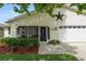 Charming single-story home boasting a screened porch, tidy landscaping, and an attached two car garage at 3370 Highland Fairways Blvd, Lakeland, FL 33810