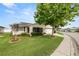Beautiful single Gathering home featuring a lush green lawn, mulch landscaping, and cozy screened in porch at 3370 Highland Fairways Blvd, Lakeland, FL 33810