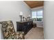 Cozy room with wood ceiling, floral accent chair, and decorative lighting at 3370 Highland Fairways Blvd, Lakeland, FL 33810