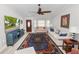 Living room with ceiling fan and front door at 3370 Highland Fairways Blvd, Lakeland, FL 33810