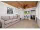 Cozy living room with wood ceiling, neutral tones, and comfortable seating at 3370 Highland Fairways Blvd, Lakeland, FL 33810