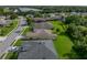Aerial view of a home in a quiet neighborhood, with a well-maintained lawn and nearby trees and greenery at 3427 Waterlute Way, Lakeland, FL 33811