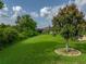 The lush green backyard is spacious and inviting, perfect for outdoor activities at 3427 Waterlute Way, Lakeland, FL 33811