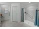 Bright bathroom showcasing an accessible shower with grab bars and seating at 3427 Waterlute Way, Lakeland, FL 33811