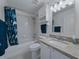 Bathroom with granite countertop, vanity, and tub with shower at 3427 Waterlute Way, Lakeland, FL 33811