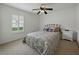 Bedroom with neutral decor, plantation shutters and ceiling fan at 3427 Waterlute Way, Lakeland, FL 33811
