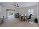 Cozy bedroom featuring a ceiling fan, chair, and ample natural light at 3427 Waterlute Way, Lakeland, FL 33811