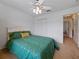 Bright bedroom with carpet, ceiling fan, and double door closet at 3427 Waterlute Way, Lakeland, FL 33811