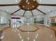 Large recreation area featuring an octagonal ceiling, wood floor, and a decorative nature-themed mural at 3427 Waterlute Way, Lakeland, FL 33811