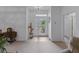 Bright and welcoming foyer featuring tile flooring and modern decor at 3427 Waterlute Way, Lakeland, FL 33811