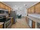 The kitchen boasts stainless steel appliances, abundant cabinetry, and tile flooring, with eat in kitchen nook at 3427 Waterlute Way, Lakeland, FL 33811