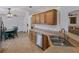 Lovely kitchen with stainless steel appliances, wooden cabinetry, eat in kitchen nook and breakfast bar at 3427 Waterlute Way, Lakeland, FL 33811