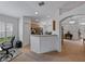 A modern kitchen features stainless steel appliances, wooden cabinetry, and recessed lighting at 3427 Waterlute Way, Lakeland, FL 33811