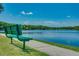 A serene lake view with a bench, perfect for relaxing and enjoying the natural surroundings at 3427 Waterlute Way, Lakeland, FL 33811