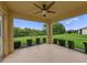 Screened lanai offering an outdoor living space with a scenic backyard view at 3427 Waterlute Way, Lakeland, FL 33811