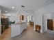Open concept floor plan showcasing the seamless flow between the kitchen, living, and dining areas at 3427 Waterlute Way, Lakeland, FL 33811