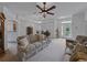 Spacious living room with neutral carpet and ample natural light, perfect for relaxing at 3427 Waterlute Way, Lakeland, FL 33811