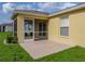 Rear exterior showcasing the screened patio, perfect for outdoor relaxation, and a well-maintained yard at 3427 Waterlute Way, Lakeland, FL 33811