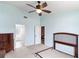 Large bedroom with light blue walls, neutral carpet, ceiling fan, and dresser at 367 Cloverdale Rd, Winter Haven, FL 33884