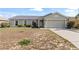 Well-maintained single-story home with a neutral color scheme, landscaped yard, and attached garage at 367 Cloverdale Rd, Winter Haven, FL 33884