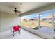 Screened-in patio with ceiling fan, ideal for outdoor relaxation and entertaining overlooking the yard at 367 Cloverdale Rd, Winter Haven, FL 33884