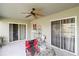 Covered patio with ceiling fan, perfect for enjoying outdoor space, with sliding glass doors at 367 Cloverdale Rd, Winter Haven, FL 33884