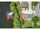 An aerial view of the lakefront community pool and dock at 3806 Osprey Pointe Cir, Winter Haven, FL 33884