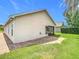 This house has a brick patio and a screened-in door with manicured lawn and lush foliage at 3806 Osprey Pointe Cir, Winter Haven, FL 33884