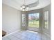 Cozy dining area with natural light and a view of the landscaped front yard at 3806 Osprey Pointe Cir, Winter Haven, FL 33884
