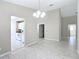 Bright and open dining room with ceramic floors located next to the kitchen at 3806 Osprey Pointe Cir, Winter Haven, FL 33884