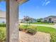 View from the porch looking out on the landscaped front yard at 3806 Osprey Pointe Cir, Winter Haven, FL 33884
