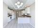 Spacious kitchen with white cabinets, modern appliances, and an island counter at 3806 Osprey Pointe Cir, Winter Haven, FL 33884