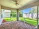 Screened-in lanai with brick-paver flooring and view of a well-maintained backyard at 3806 Osprey Pointe Cir, Winter Haven, FL 33884