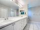 Bathroom featuring double sinks, a vanity with drawers, and a glass enclosed shower at 3806 Osprey Pointe Cir, Winter Haven, FL 33884