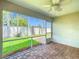 Screened patio with brick pavers and a view of the green backyard at 3806 Osprey Pointe Cir, Winter Haven, FL 33884