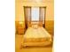 Bedroom with neutral decor, featuring a window with curtain and side table at 4102 Lake Marion Golf Resort # 4102, Kissimmee, FL 34759