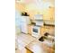 Efficient kitchen featuring white appliances and ample counter space for meal preparation and storage at 4102 Lake Marion Golf Resort # 4102, Kissimmee, FL 34759