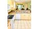 Well-lit kitchen with stainless steel appliances, a breakfast bar and an open layout at 4102 Lake Marion Golf Resort # 4102, Kissimmee, FL 34759