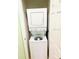 Laundry room with stacked washer and dryer at 4102 Lake Marion Golf Resort # 4102, Kissimmee, FL 34759