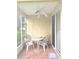 Enclosed patio featuring a ceiling fan, table and four chairs at 4102 Lake Marion Golf Resort # 4102, Kissimmee, FL 34759