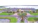 Aerial shot of the beautiful clubhouse with a lake in the background and lush green landscaping at 4188 Muirfield Loop, Lake Wales, FL 33859