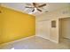 Bedroom featuring tile flooring, ceiling fan, and double door closet at 4188 Muirfield Loop, Lake Wales, FL 33859