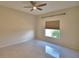 Bedroom with tile floors, ceiling fan and natural light at 4188 Muirfield Loop, Lake Wales, FL 33859