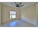 Bedroom with tile floor, a window with a view, and light-colored walls at 4188 Muirfield Loop, Lake Wales, FL 33859